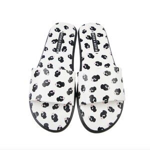 White leather Alice + Olivia Taleen slide sandals with Stace Face motif | 8.5